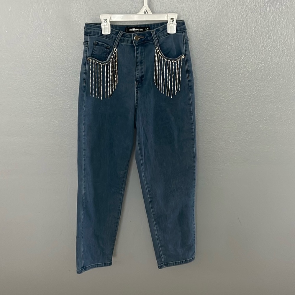 I am selling dollhouse sparkly blue jeans in a size 5/6. These are new.